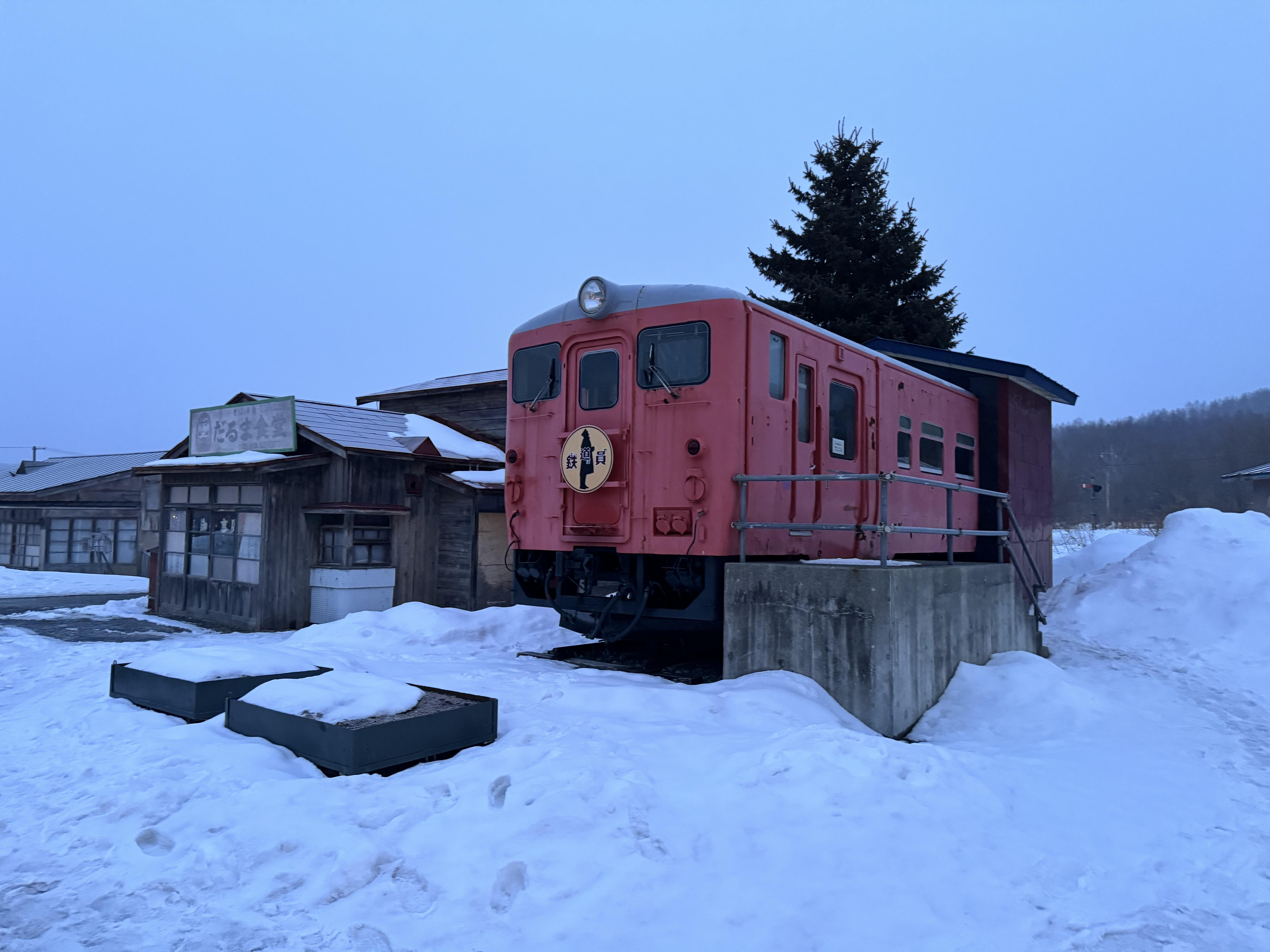 Old train at Ikutora Station in snow